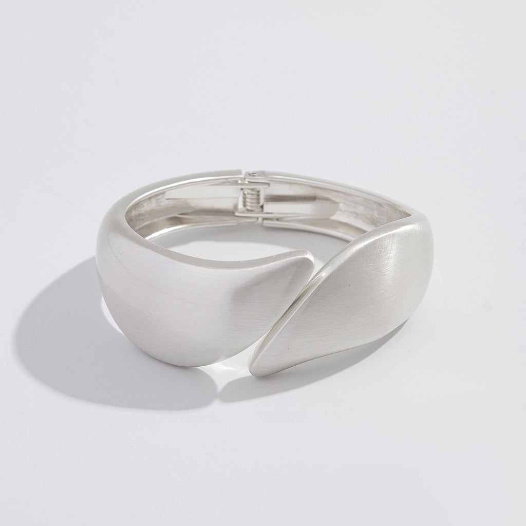 Punk-style exaggerated bracelet, wide irregular spring clasp, niche metal jewelry.