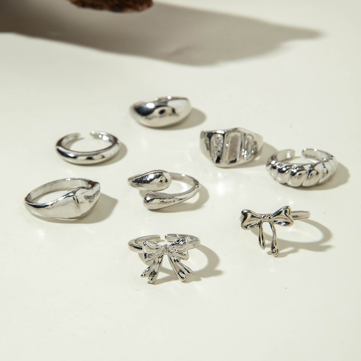 Unique, understated luxury glossy ring set with a distinctive bow design for women
