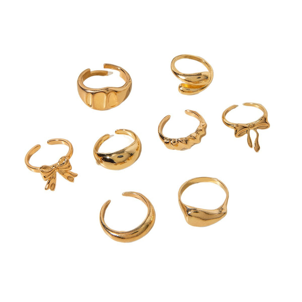 Unique, understated luxury glossy ring set with a distinctive bow design for women