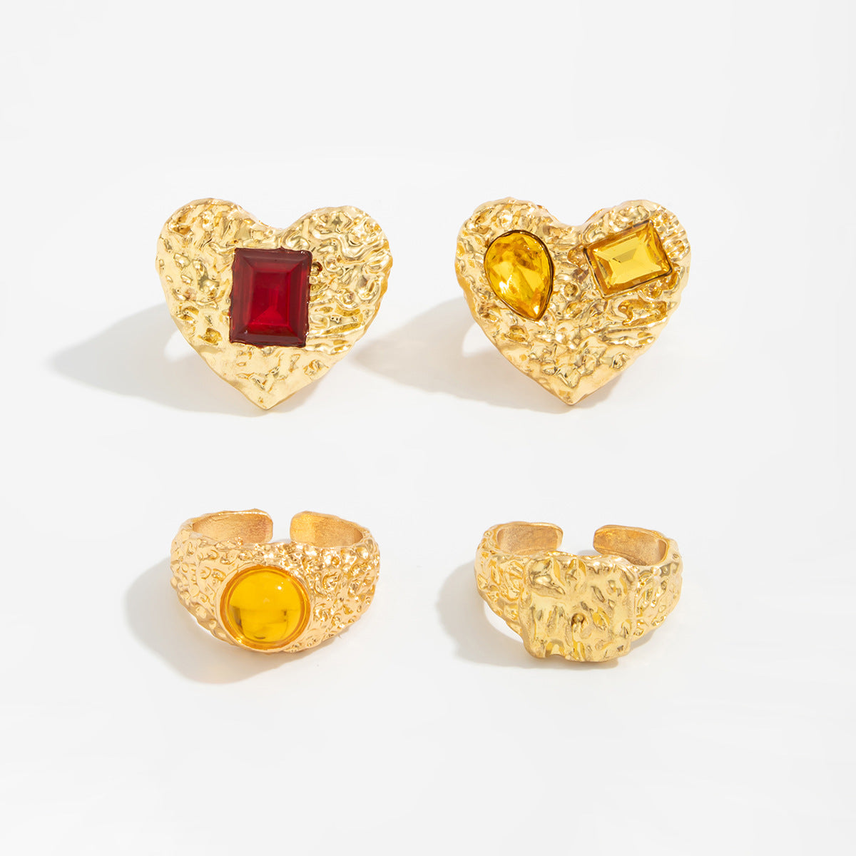 Instagram-worthy metallic lava heart-shaped ring with a design featuring square diamonds and a knuckle setting.