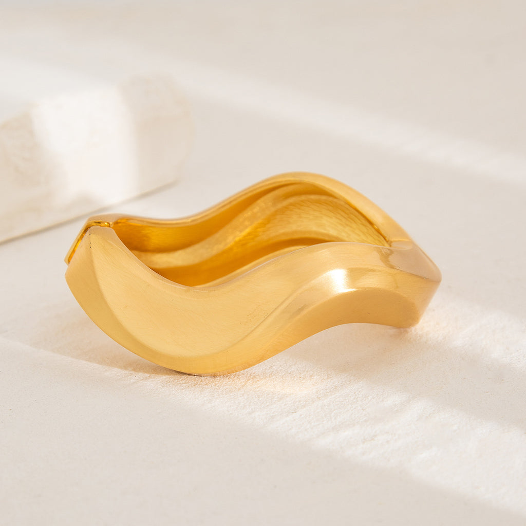 Punk-style exaggerated bracelet, wide irregular spring clasp, niche metal jewelry.