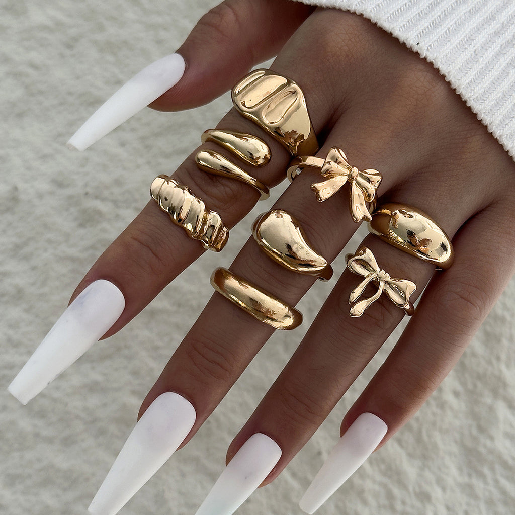 Unique, understated luxury glossy ring set with a distinctive bow design for women