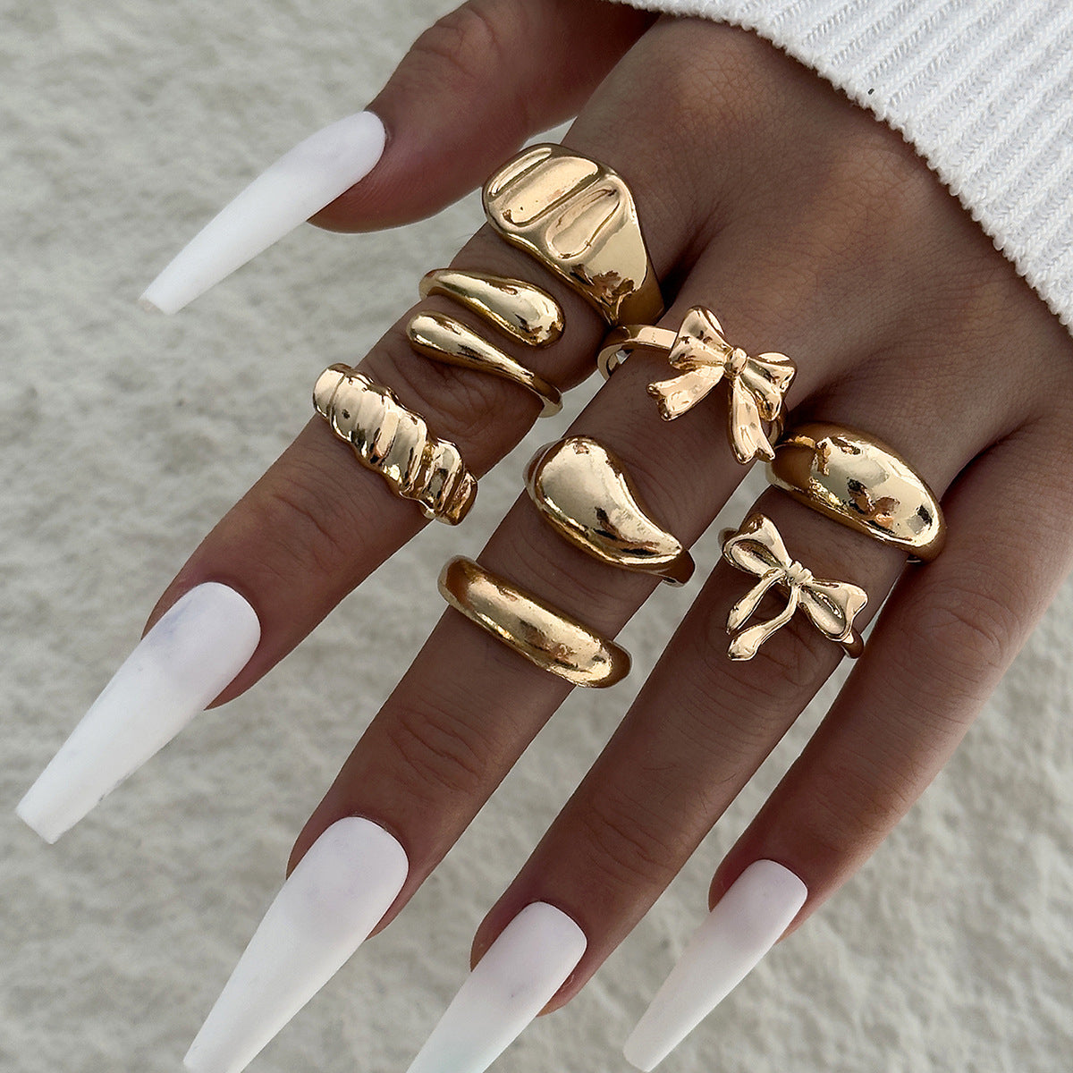 Unique, understated luxury glossy ring set with a distinctive bow design for women