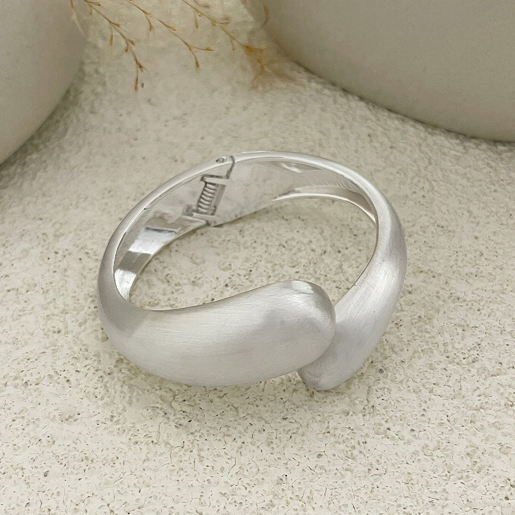 Punk-style exaggerated bracelet, wide irregular spring clasp, niche metal jewelry.