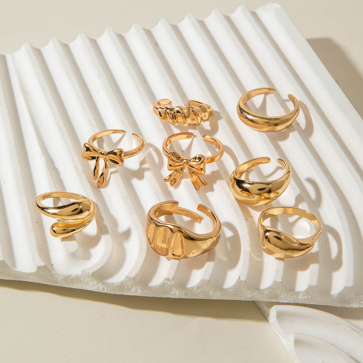 Unique, understated luxury glossy ring set with a distinctive bow design for women